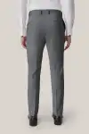 Man wearing tan Birdy Grey suit in slim fit, facing toward the camera.