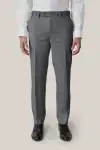 Man wearing tan Birdy Grey suit in classic fit, facing toward the camera.