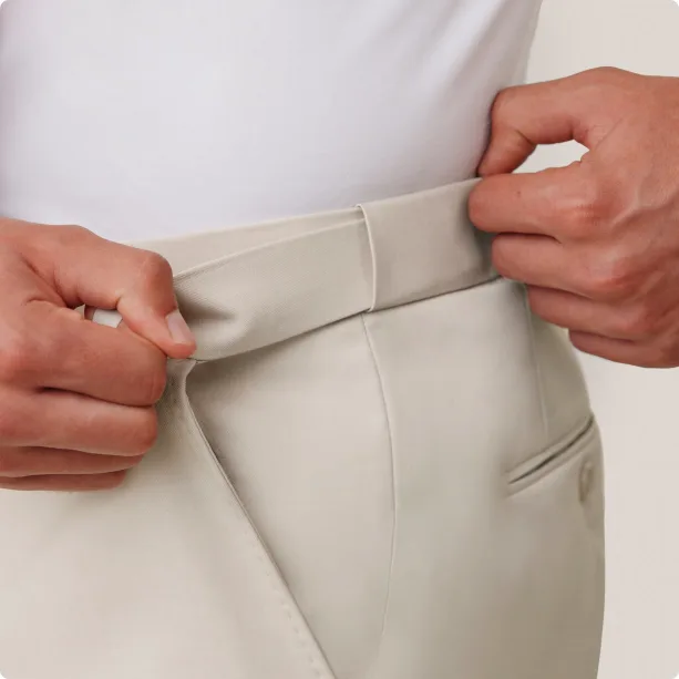 Demonstration of stretchy, elastic waistband on suit pants.